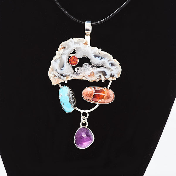 Stunning hand made sterling sliver pendant with agate slice, turquoise, Mexican fire opal, and ruby
