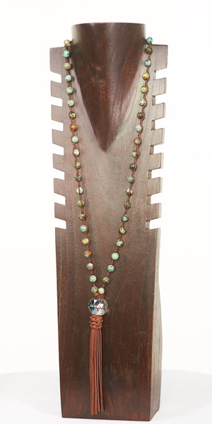 Long beaded necklace with crystal and leather tassel