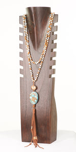 Long necklace with turquoise colored stone